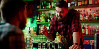 bartender talking to customer staff turnover hostility industry BevSpot